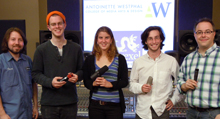 Photograph of winning students holding their microphones
